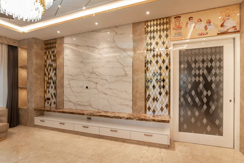 Room with a white marble feature wall above a low cabinet, flanked by diamond-patterned glass panels and a patterned glass door