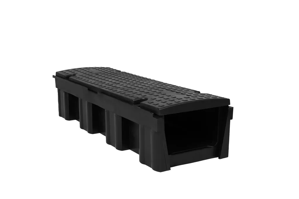 Black moulded trench section photographed on a white background